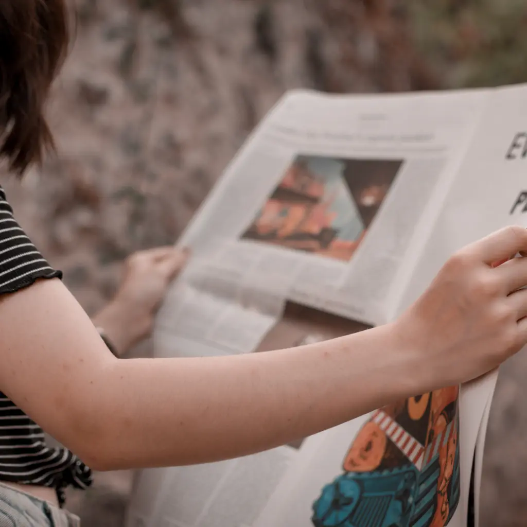 Canva - Person Reading Newspaper