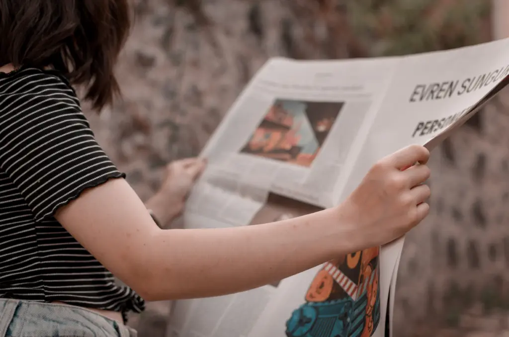 Canva - Person Reading Newspaper